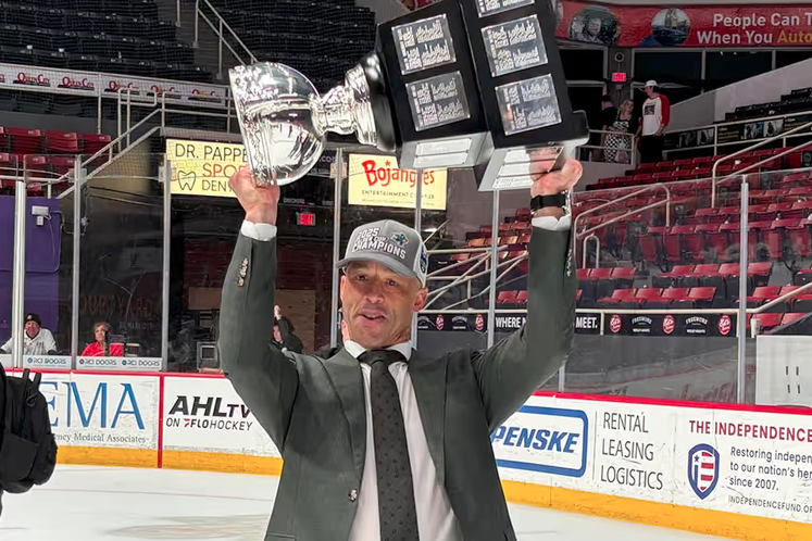<who>Photo Credit: AHL</who>Manny Malhotra lifts the Calder Cup in 2025.